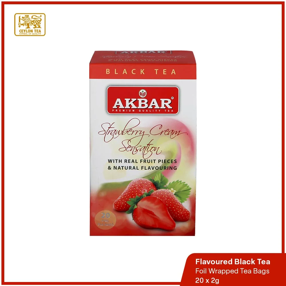 Strawberry Cream Sensation Flavoured Black Tea, a luxurious blend featuring high-grown black tea infused with natural fruit pieces.